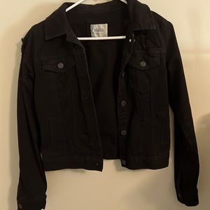Size small black jean jacket with ripped holes throughout
